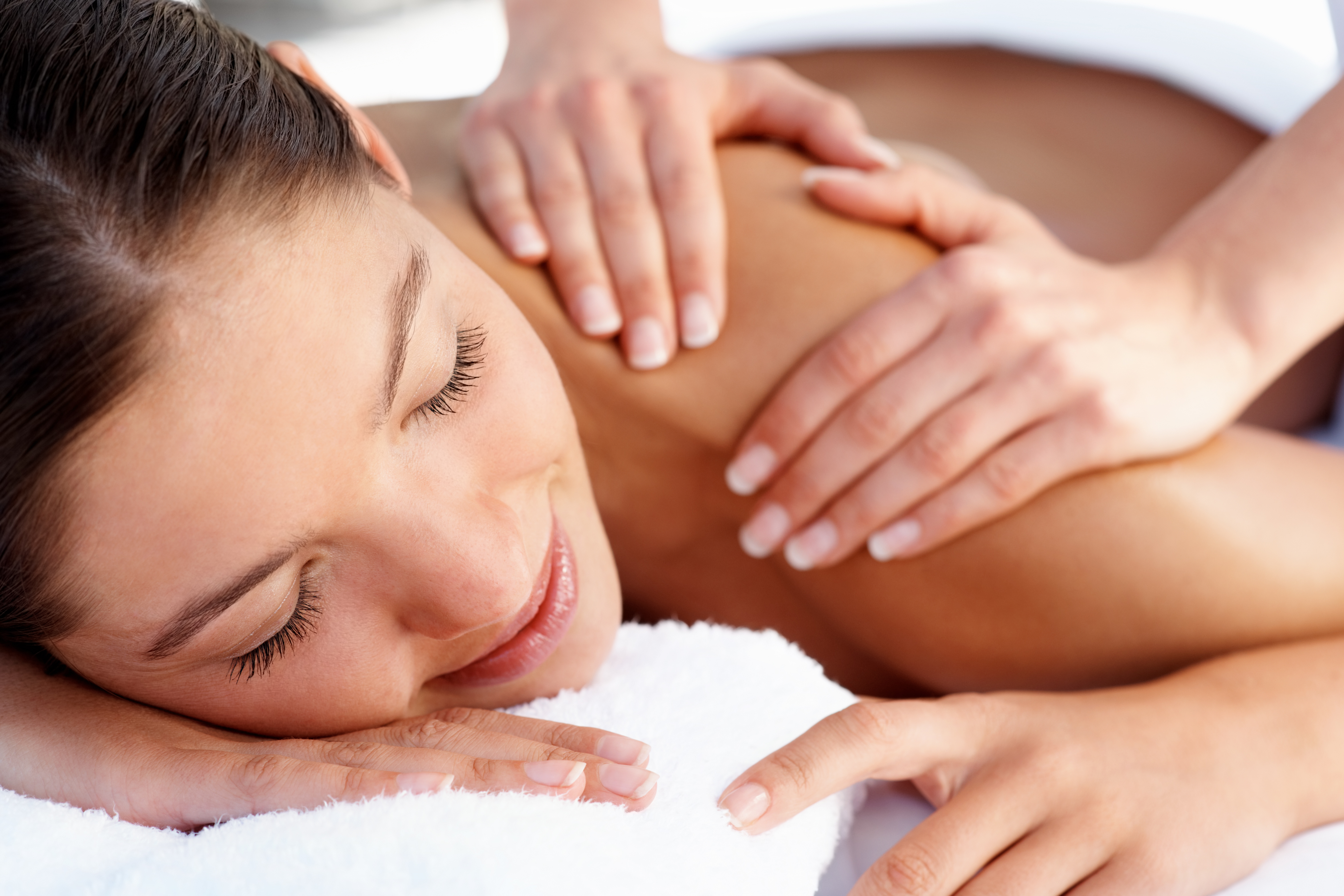 bigstock-Masseuse-Massaging-Woman-s-Sho-5002258