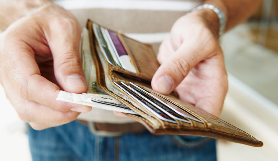 Man removes cash from wallet